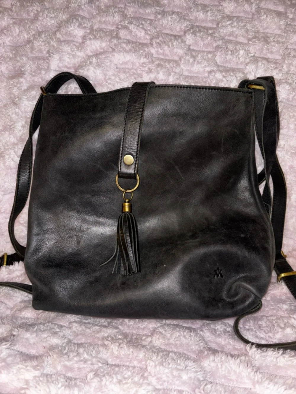 Elevate Black Leather convertible crossbody/backpack with tassel